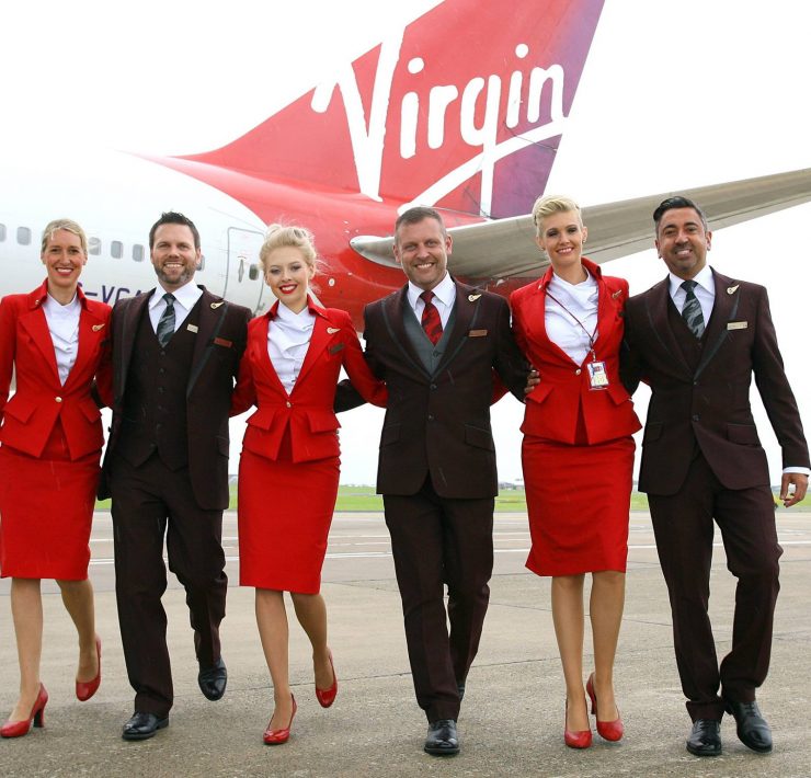 a group of people in red suits