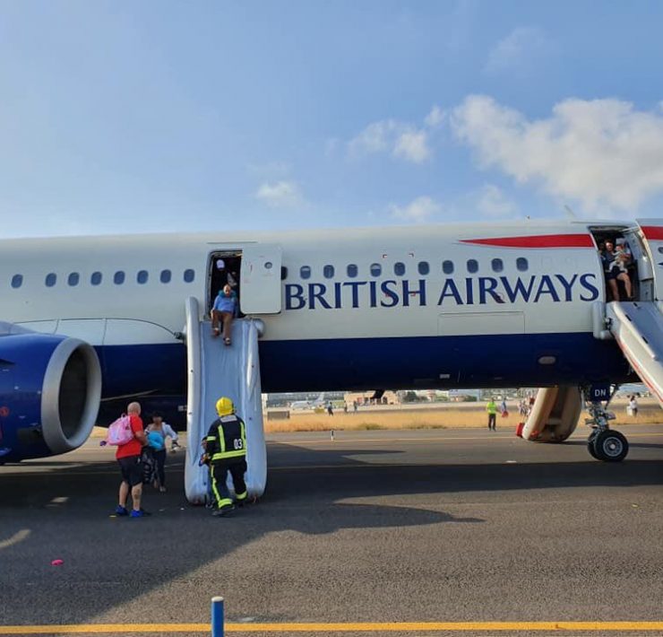 a group of people boarding an airplane