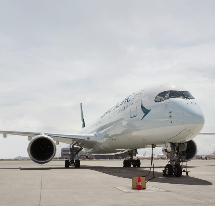 a white airplane on a runway