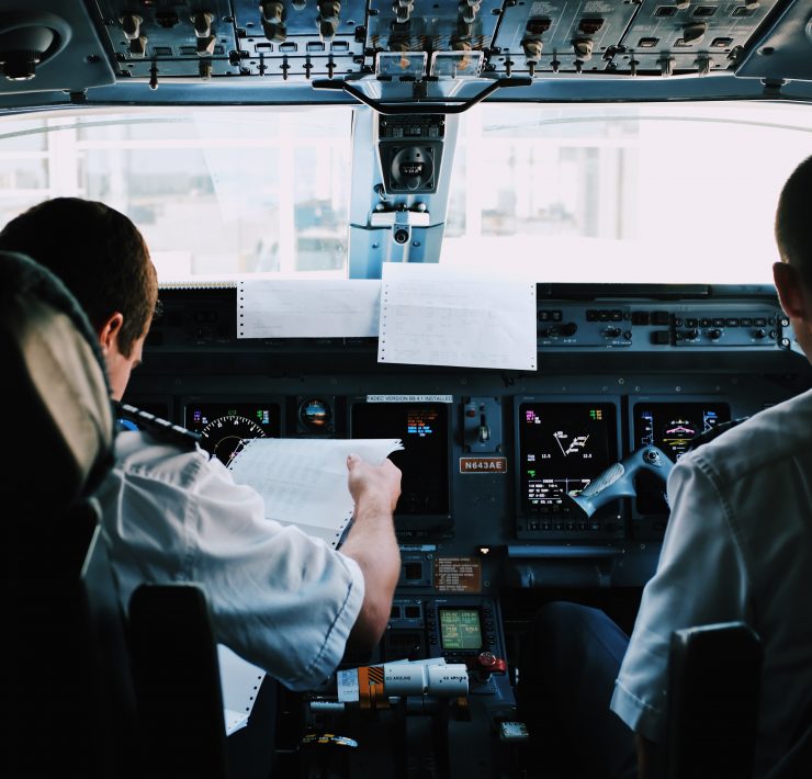 a group of men in a cockpit