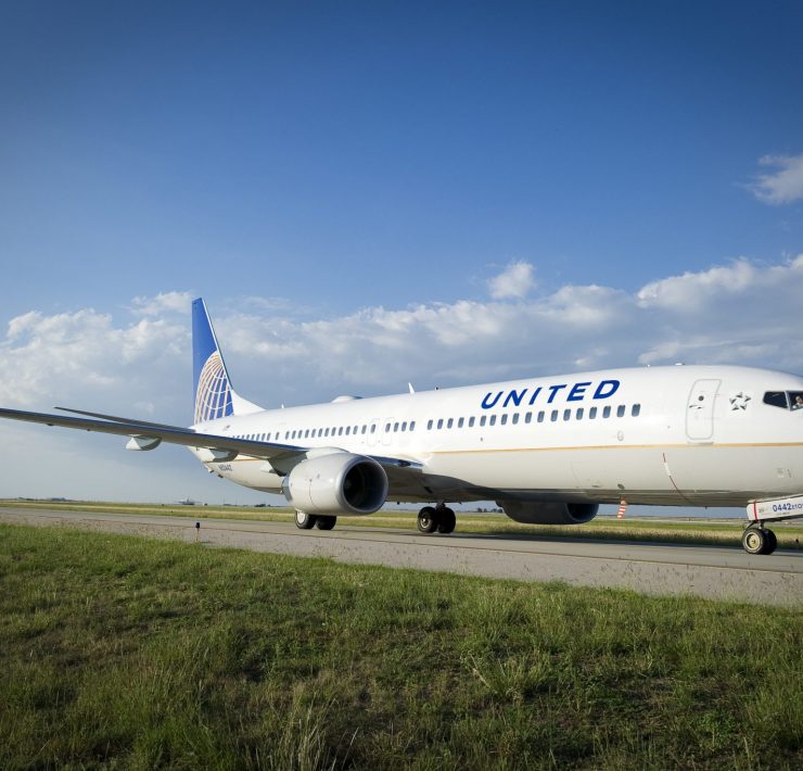 a white airplane on a runway