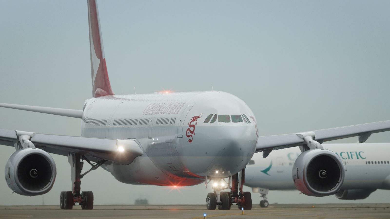 a large white airplane on a runway