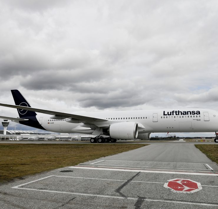 a large white airplane on a runway