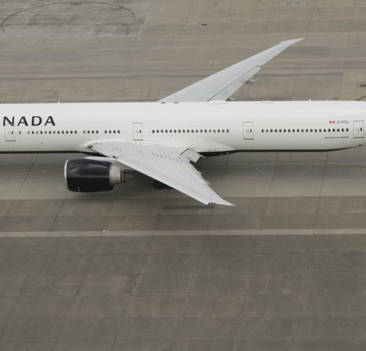 a white airplane on a runway