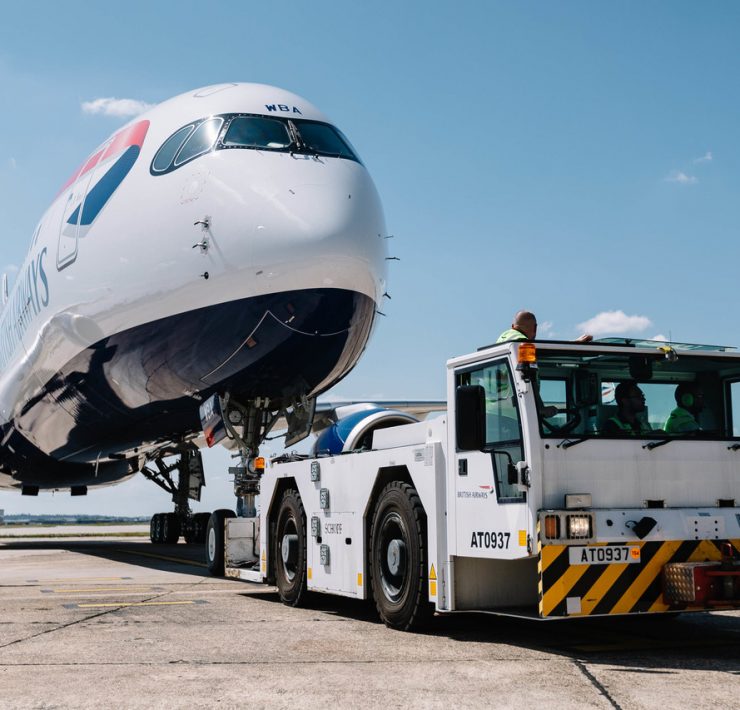 a plane being towed by a tow truck