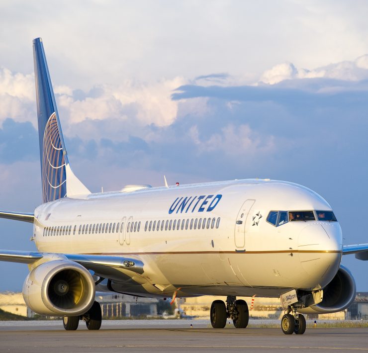 a white airplane on a runway