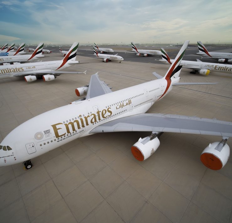 a group of airplanes on a runway