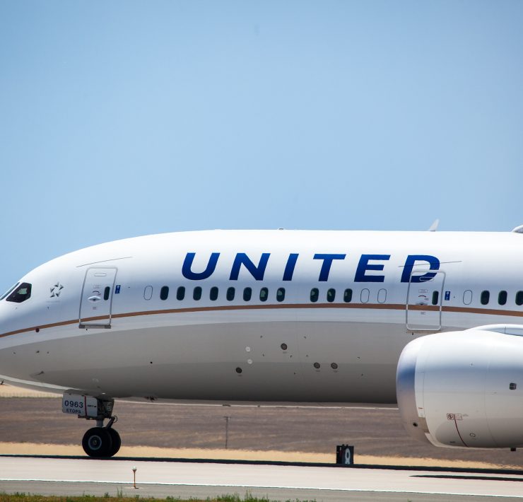 a white airplane on a runway