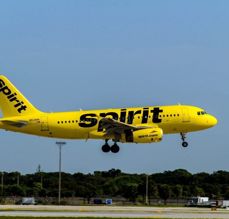 a yellow airplane taking off