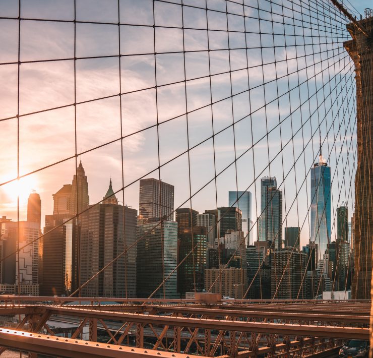 a bridge with a city in the background