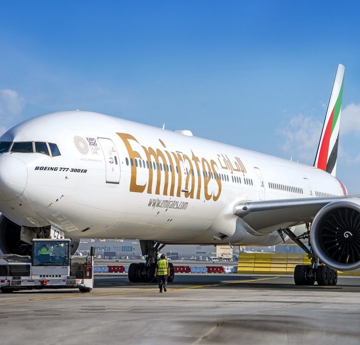 a large white airplane on a runway