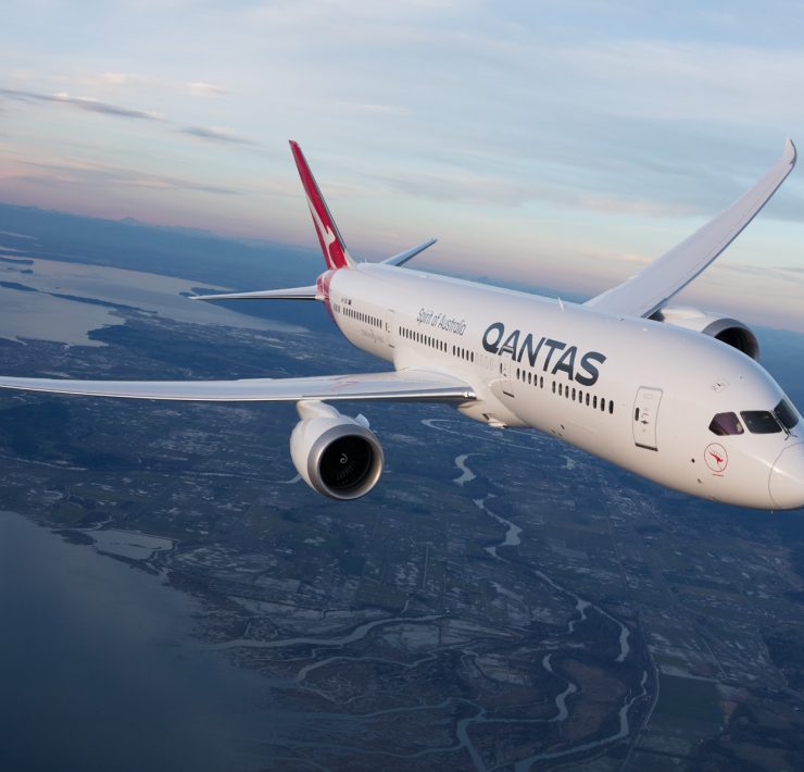 a white airplane flying in the sky