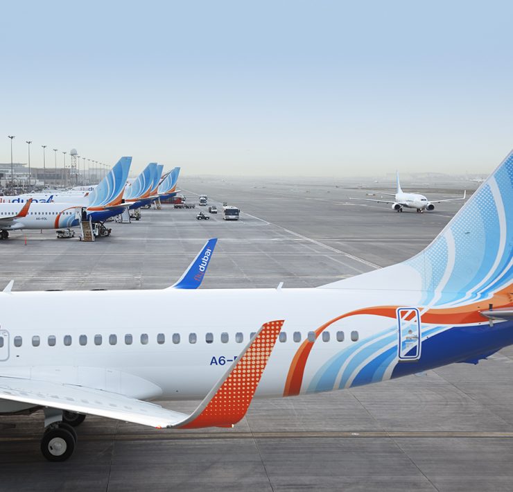 a row of airplanes on a runway