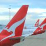 red and white airplanes with a white design on the tail