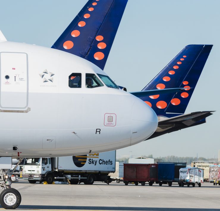 brussels airlines Airbus A320 parked in front of two other Brussels Airlines planes