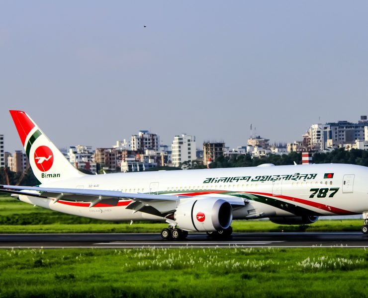 a white airplane on a runway