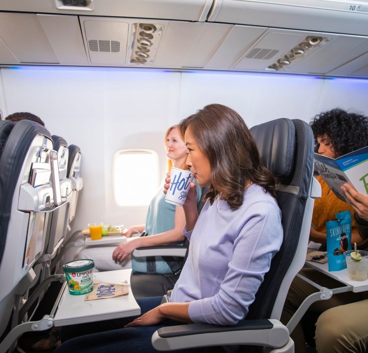 a group of people sitting in an airplane