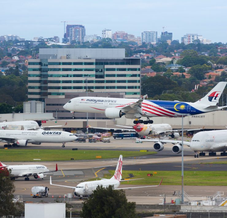 a group of airplanes on a runway