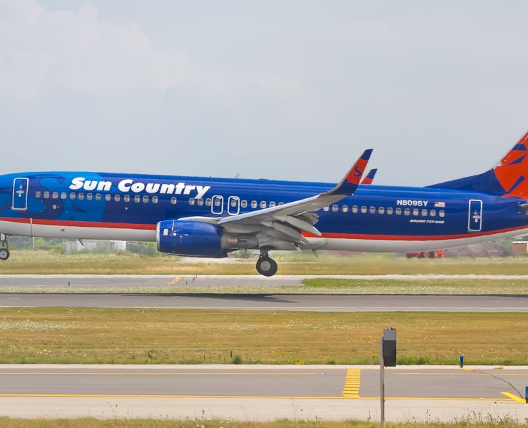 a blue airplane taking off