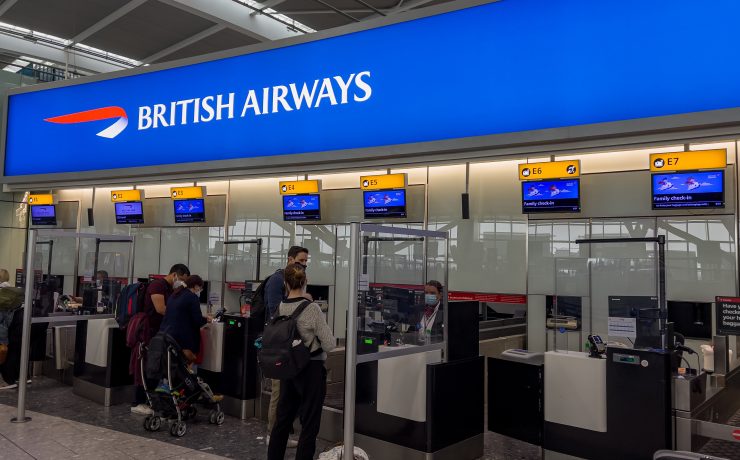 people standing in front of a check in counter