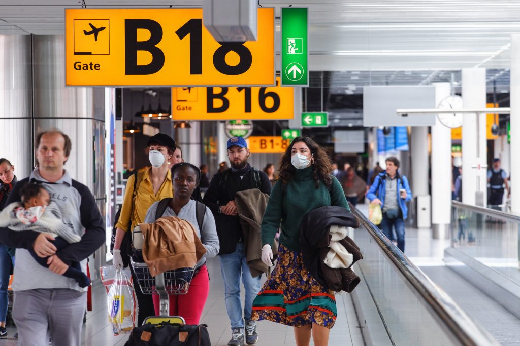 a group of people walking in an airport