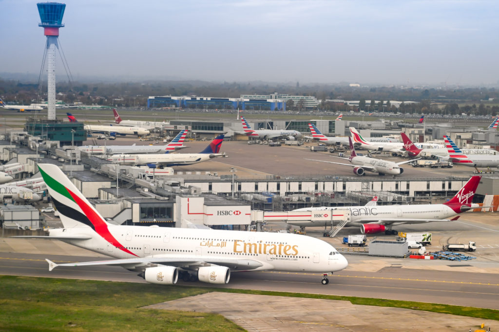 a group of airplanes at an airport