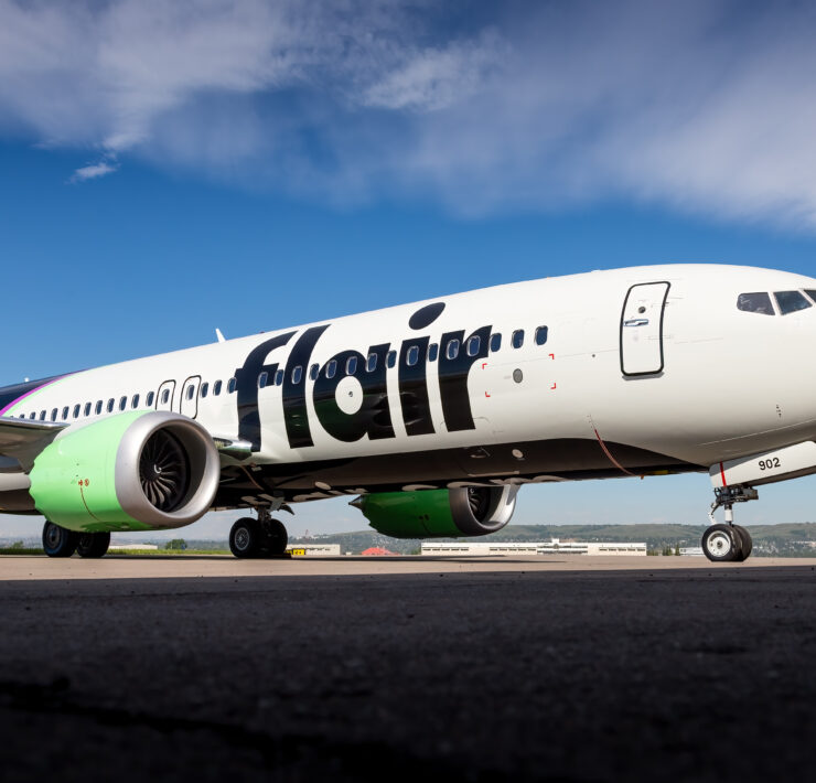 a white airplane on a runway