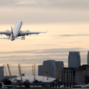 an airplane flying over a city