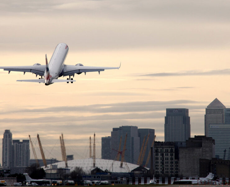 an airplane flying over a city