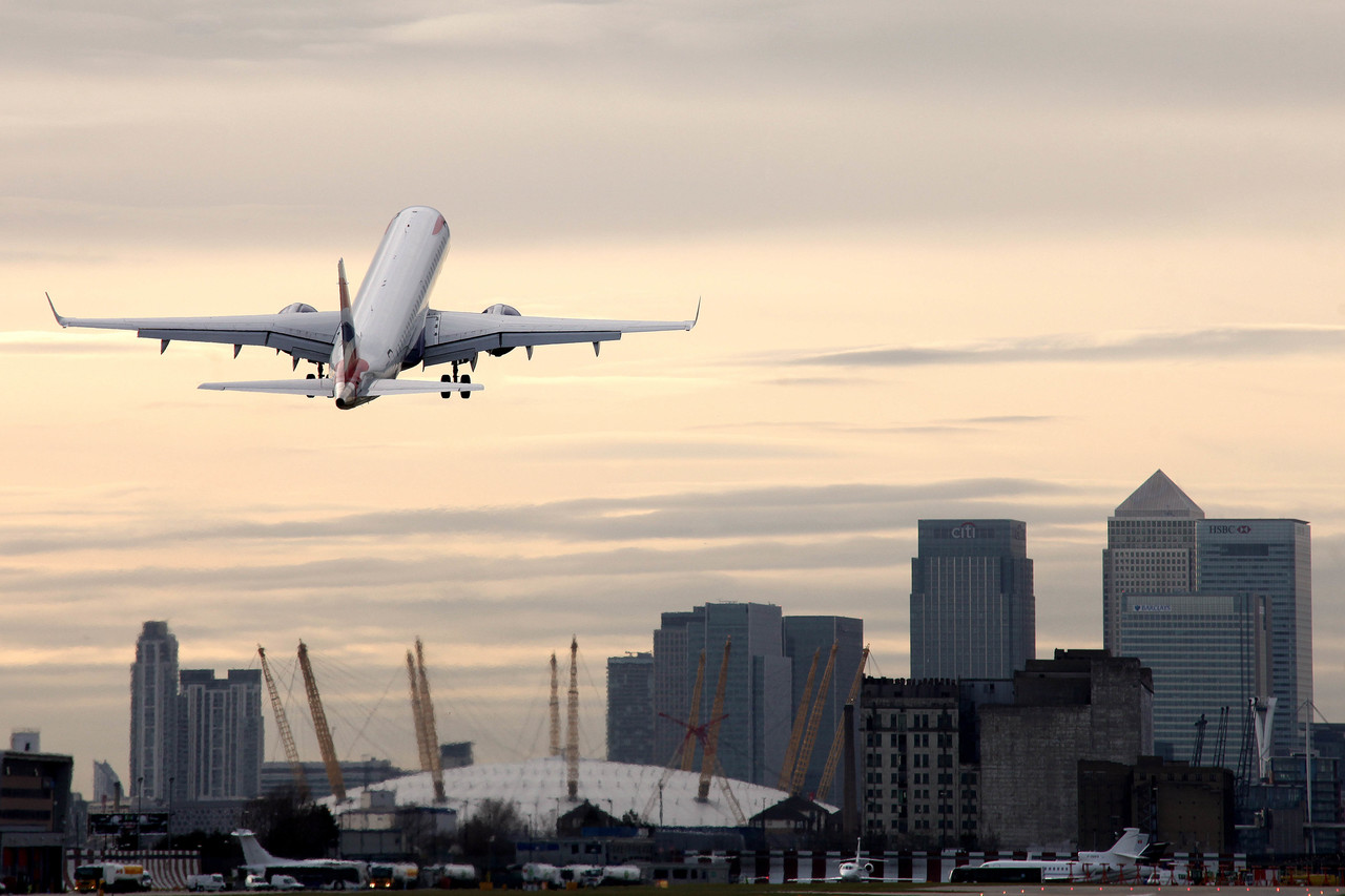 an airplane flying over a city