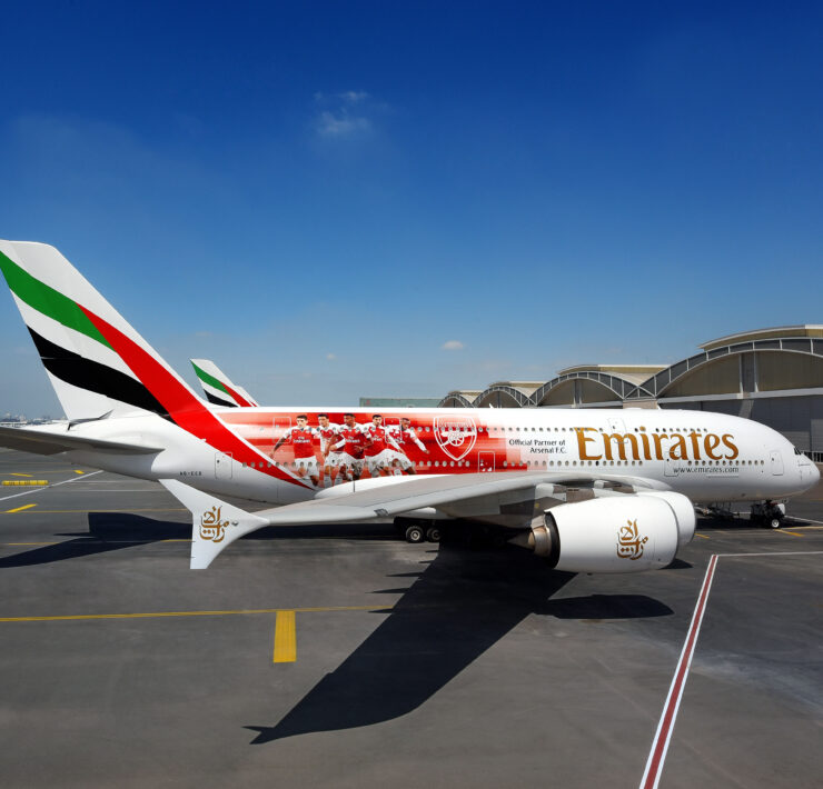 a white airplane with red and white stripes on it