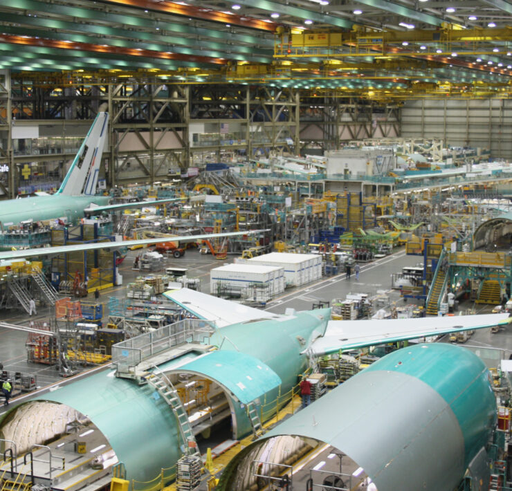 an airplane factory with many airplanes in it