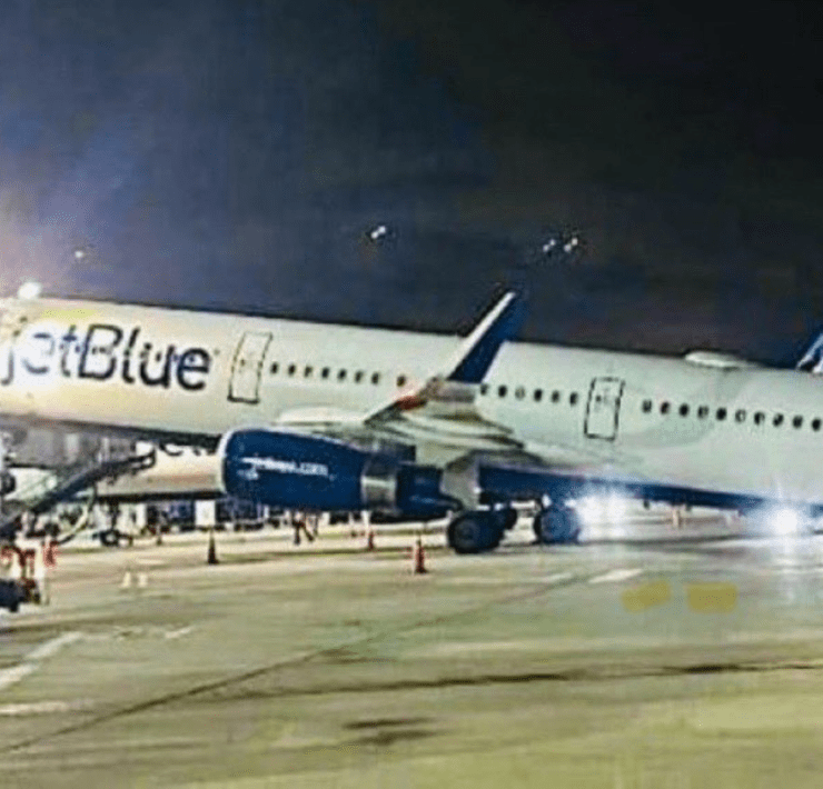 a plane on the runway at night