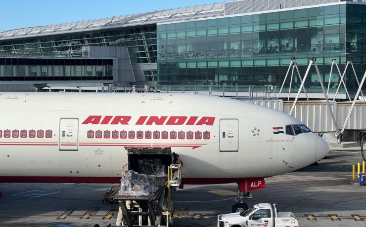 a white airplane with red writing on it