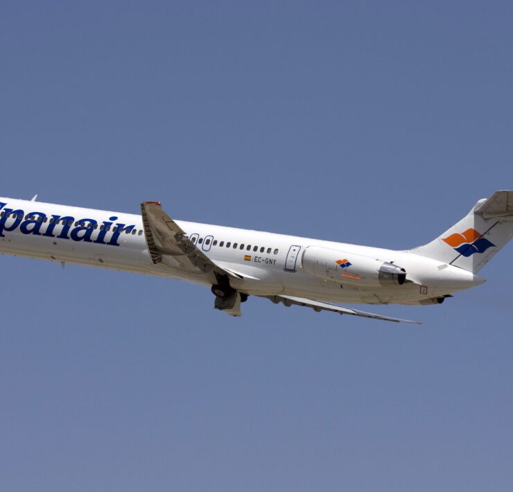 a white airplane flying in the sky