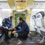 men sitting in an airplane