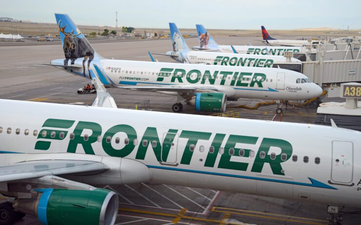 a group of airplanes parked on a runway