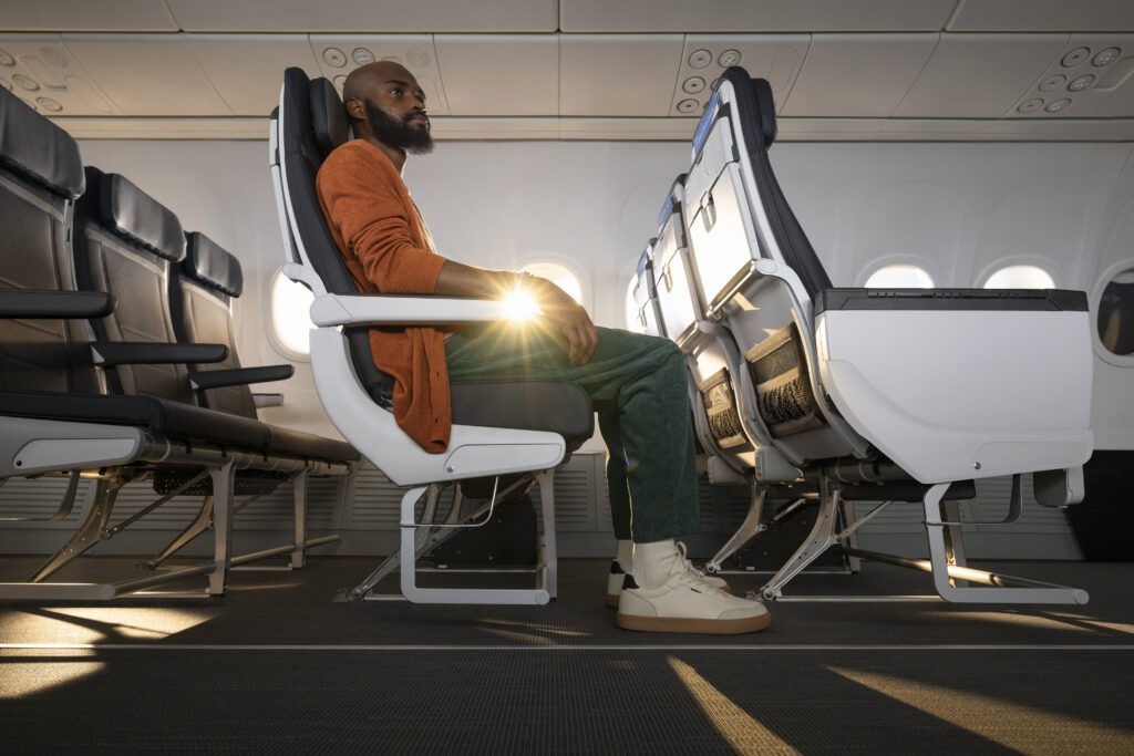 a man sitting in an airplane seat