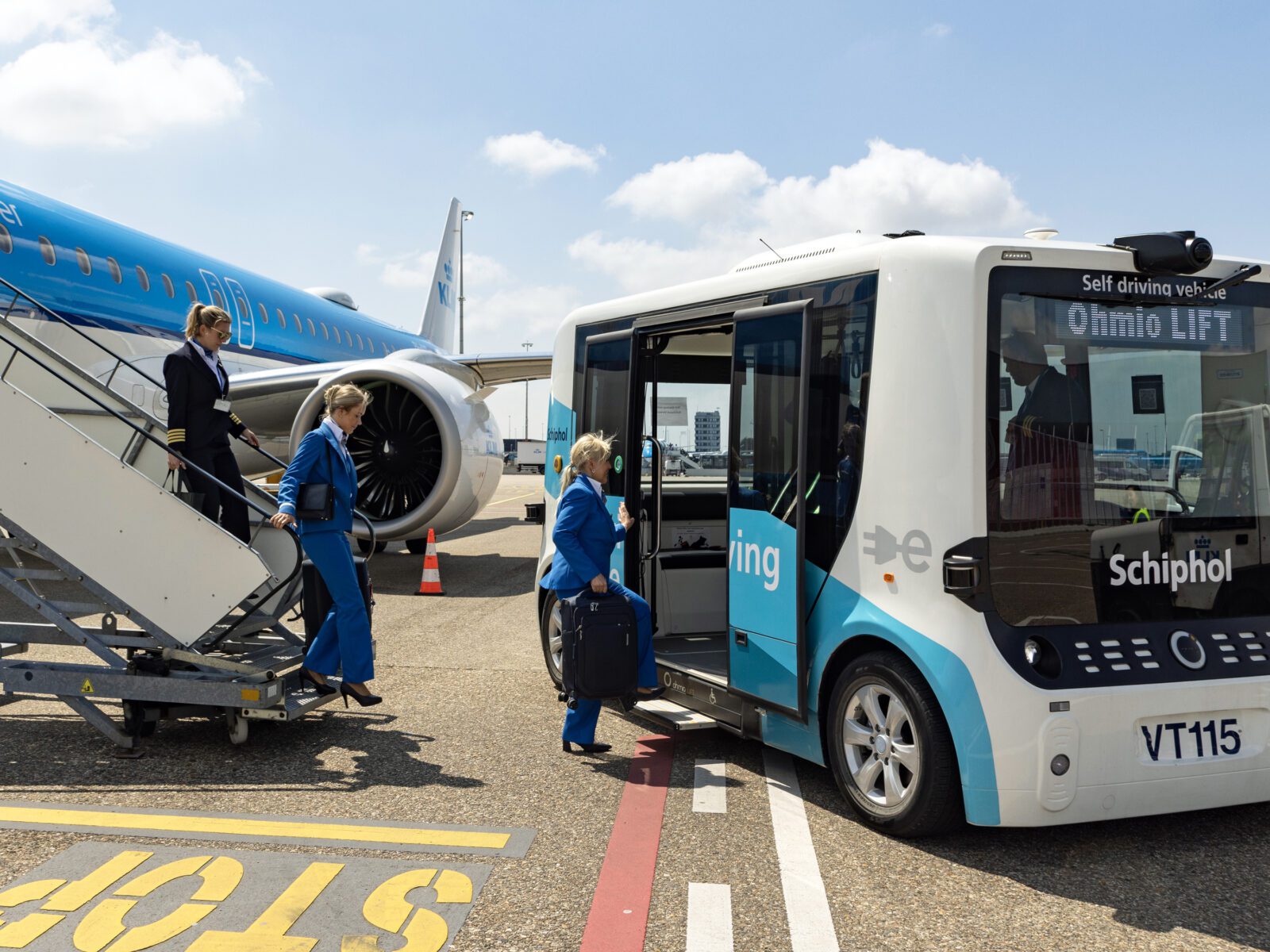 a group of people boarding a bus