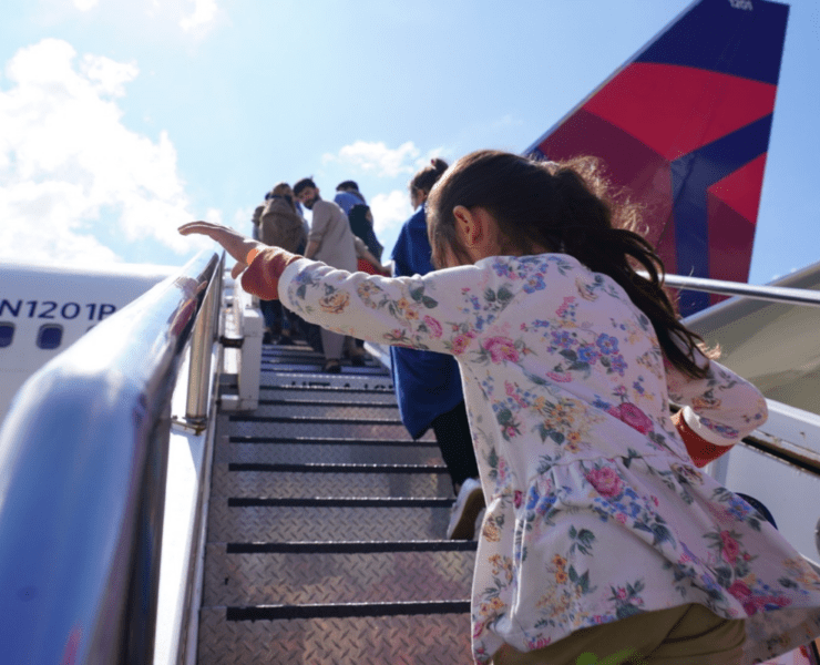 a girl climbing up a plane