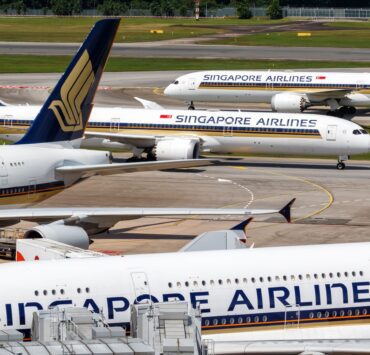 a group of airplanes on a runway