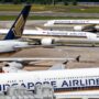 a group of airplanes on a runway