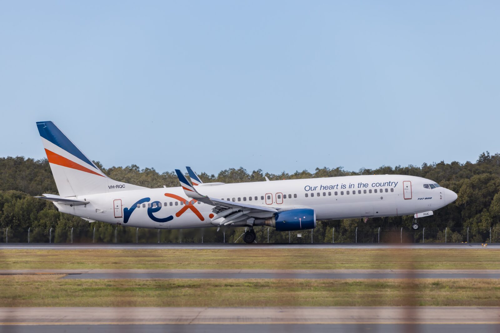 a white airplane on a runway