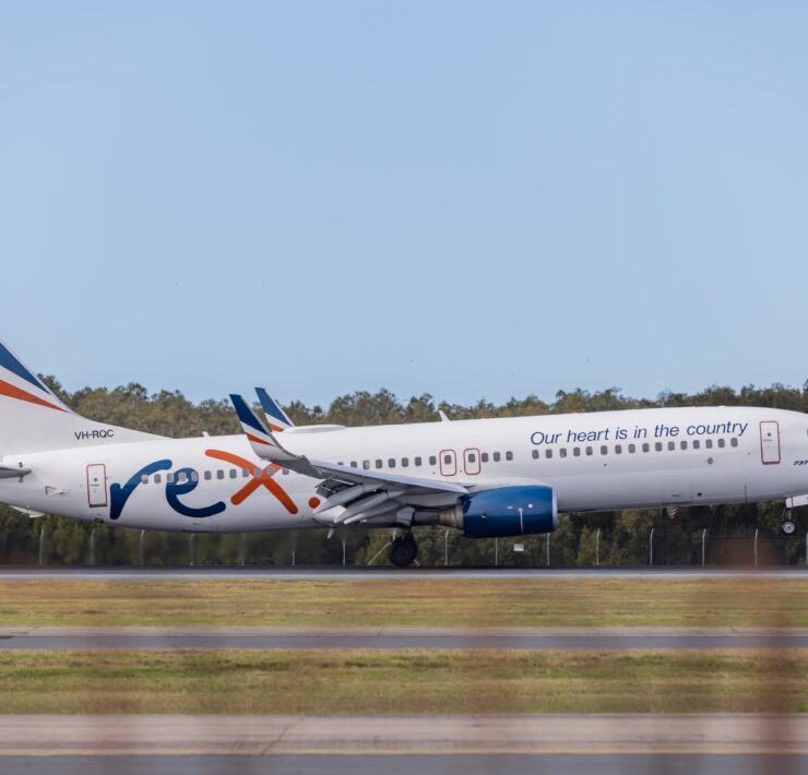 a white airplane on a runway