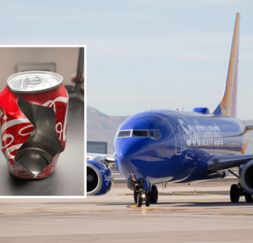 a blue airplane with a broken can