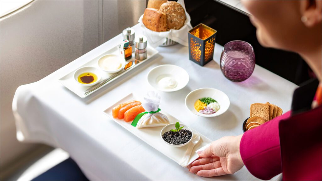 a person holding a plate of food