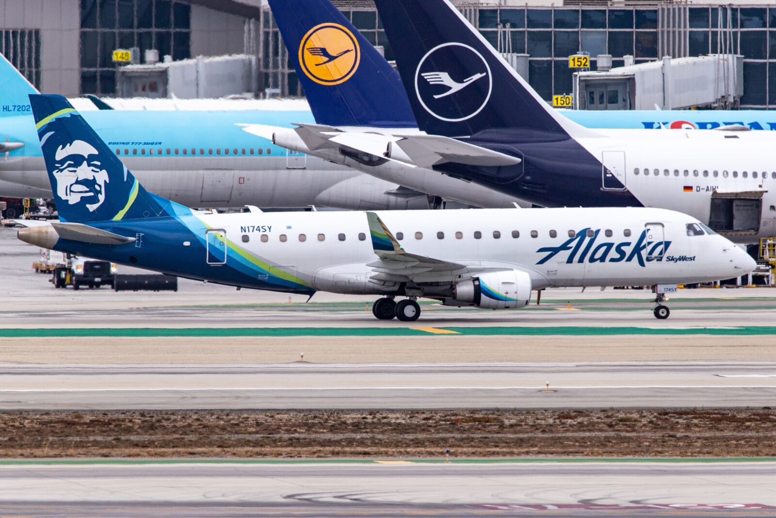 a group of airplanes on a runway