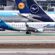 a group of airplanes on a runway