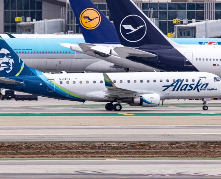 a group of airplanes on a runway