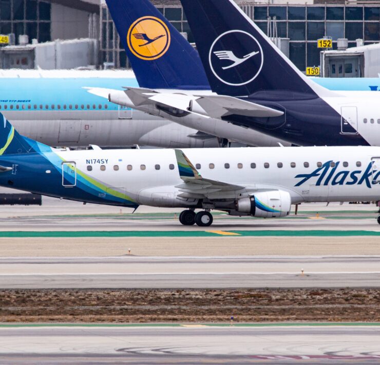 a group of airplanes on a runway